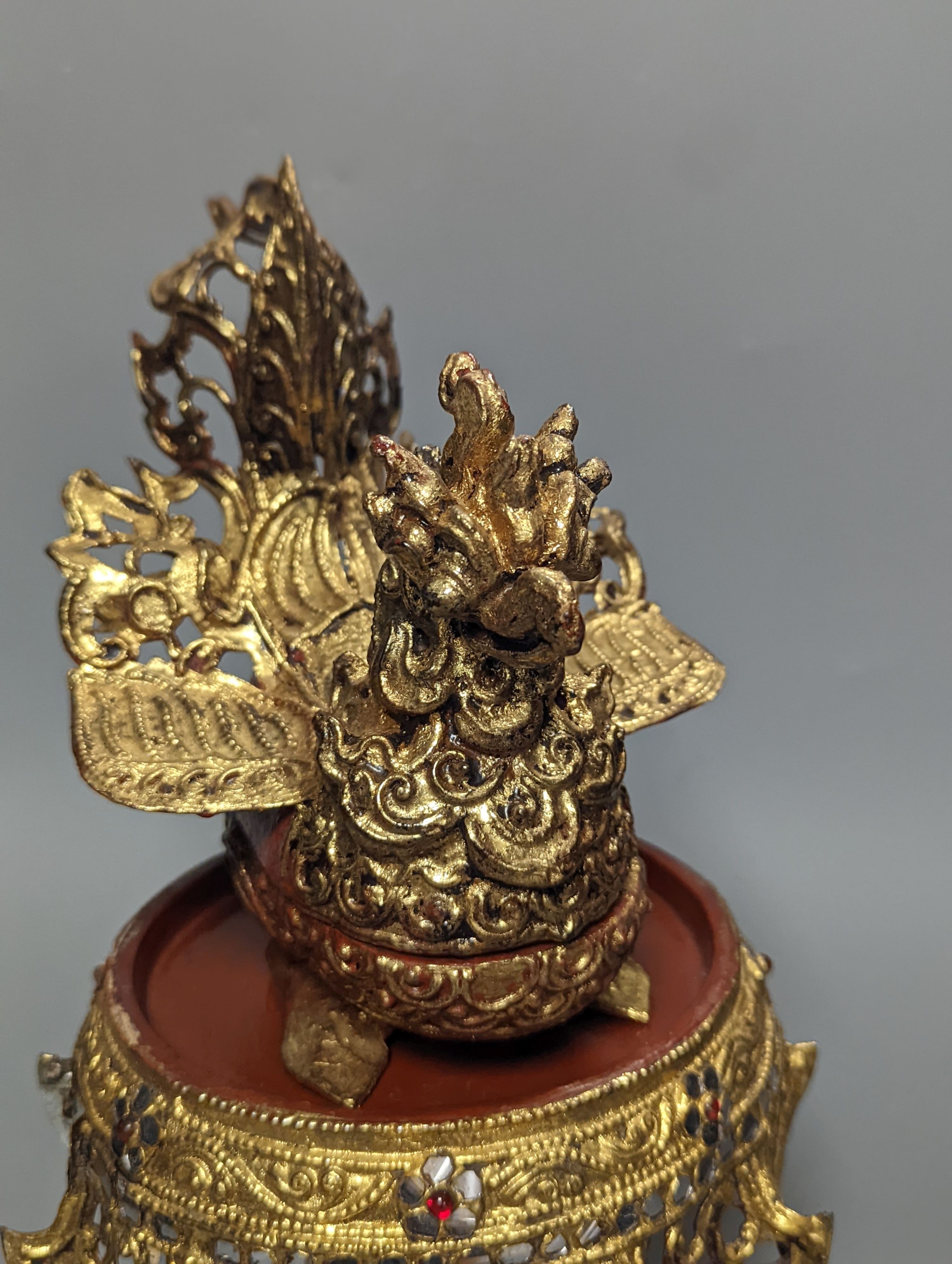 A Burmese painted gilt decorated metal, wood and composition ‘phoenix’ Betel box, total height 32cm